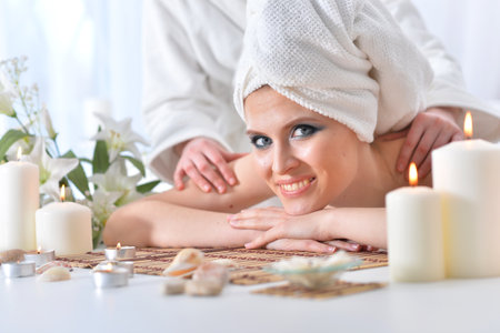 Beautiful woman in spa centar enjoying the massage.の写真素材