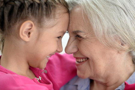 Grandmother and granddaughter sharing a joyful moment together