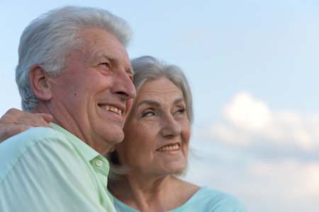 Smiling senior couple looking at the futureの写真素材