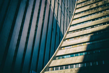 Golden ambience surrounds concrete business modern building.の写真素材