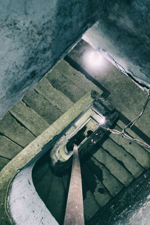 Occupied building concrete stairs in a condemned building used as home by social housing movement.の写真素材