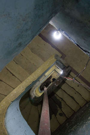 Scary concrete stairs in a ruined occupied building used as home by social housing movement.の写真素材