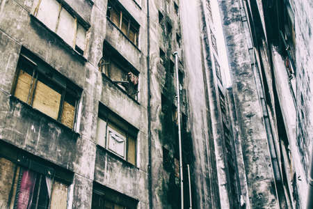 Aged and musty concrete walls of an abandoned building occupied by social housing movement.の写真素材