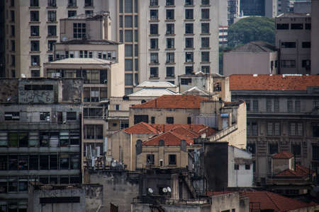 Old and polluted buildings in downtown megalopolis