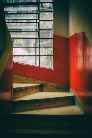 Concrete spiral staircase with red and white walls and transparent glass windows. San Paolo. Brazil. South America. No people.の写真素材