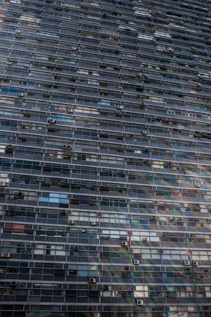 Vertical image of a huge corporate building with rectangular windows.の写真素材