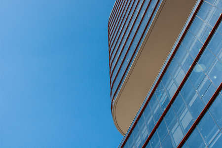 Rounded modern business building detail in a sunny dayの写真素材