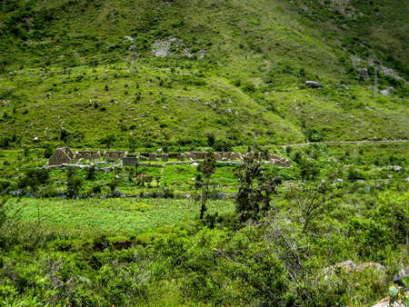 Inca ancient ruins on a green valley on the Andes mountains. Hiking the Inca trail. Peru. South America. No people.の写真素材