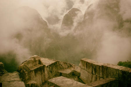 Beautiful image of Machu Picchu ruins and the clouds over the mountains on the background. Prize for...