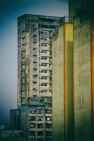 Abandoned condemned huge buildings used as slum by social housing movement on the background of an...
