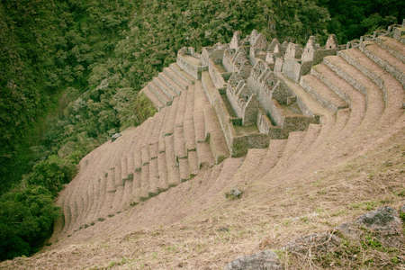 Ancient Inca ruins and farming terraces seen from the Inca Trail to Machu Picchu. Peru. South...