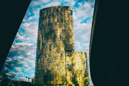 A business building facade reflects the clouds in the skyの写真素材