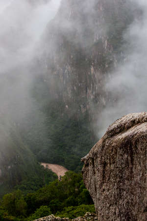 Red water of a river in the valley from a peak of a rocky mountain. Peru. South America. No people.の写真素材
