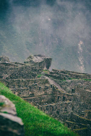 Vertical view of Machu Picchu stone ruins lost in the wild nature of the Andes mountains. Peru. South America. No people.の写真素材