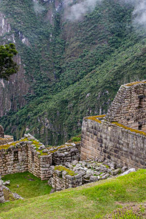 Vertical viiew of ruins of Machu Picchu Inca culture on a cliff in the Andes mountains. Peru. South America. No people.の写真素材