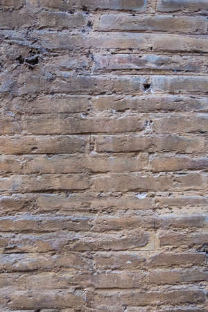 Vertical view of an old brick wall texture. No people.