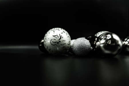 Cool holidays wallpaper background of Christmas decorations and balls or baubles on black background.の写真素材