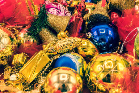 Christmas vibrant colorful wallpaper background texture of balls and decorations for the celebration tree.の写真素材