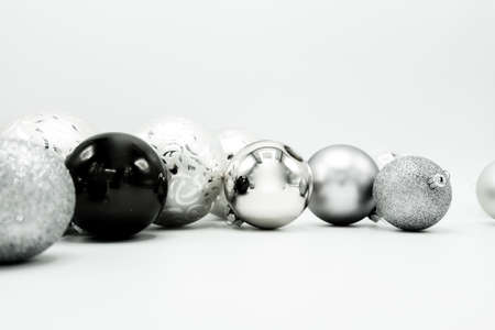 Monochrome elegant Christmas wallpaper background of tree decorations. Classy holidays image in black and white.の写真素材