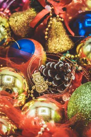 Christmas vibrant colorful wallpaper background texture of balls and decorations for the celebration tree.の写真素材