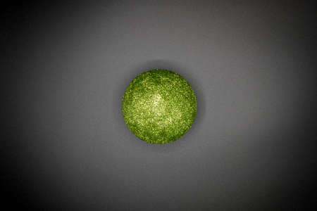 Christmas wallpaper background of green celebration tree ball isolated on black background.の写真素材