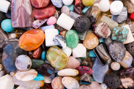 Beautiful wallpaper background of colorful jewelery beads of many shapes and materials.の写真素材