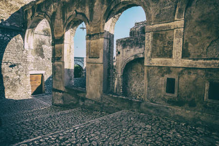 Architecture detail wallpaper background of ancient stone walls and arches of a medieval castle. No people.の写真素材