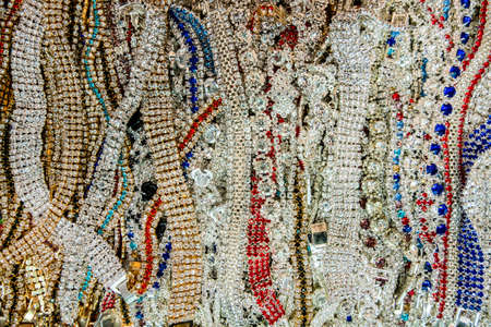 Wallpaper background of a flea market stall with jewelry and vintage bracelets with fake diamonds stones for sale.の写真素材