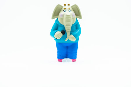 Funny toy elephant figurine with a microphone.の写真素材