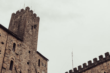 Central stone building with tower in San Gimignano, Tuscany.の写真素材