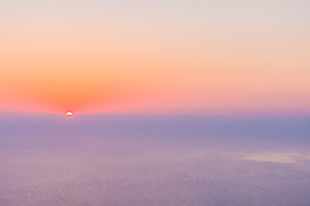Cloudy sky with sunset on the horizon.の写真素材
