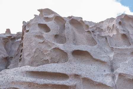 Amazing texture of the sandstone cliffs of Santorini island, Greece.の写真素材