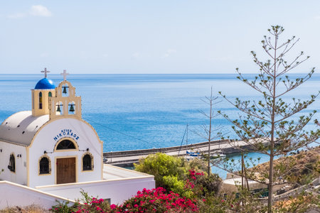 Church with blue dome of Santorini island, Greeceの写真素材