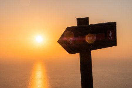 Direction sign of the city of Oia along the hiking way.の写真素材