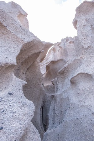 Abstract shapes created by the constant winds on the walls of the coast of santorini islandの写真素材