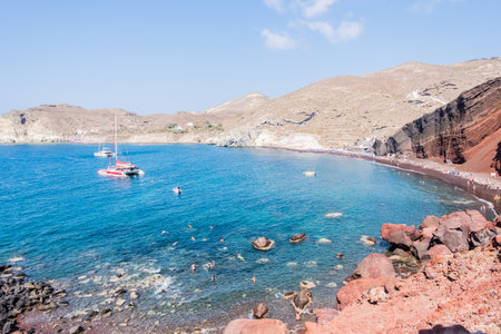 The red earth of the rocky coast of the red beach in santoriniの写真素材