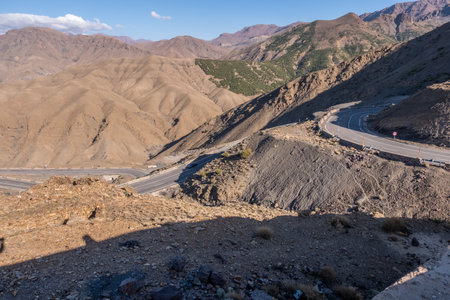 The road full of curves to cross the atlas mountains in moroccoの写真素材