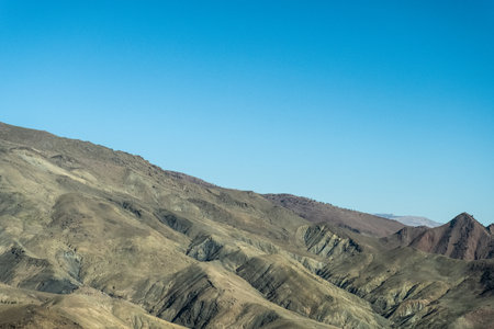Journey through the mountains on this scenic and curvy roadの写真素材