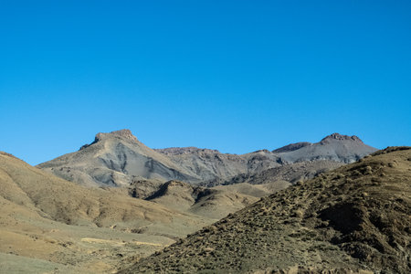 Take in the sweeping mountain vistas as you travel along this curvy roadの写真素材