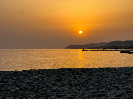 Sunrise Serenity: Greek Amphorae by the Calm Sea Malia Beach - Crete - July - 2023の写真素材