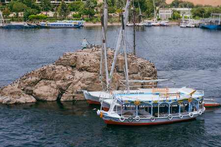 Egypt Summer Travel Riverside Tranquility: Small Boats by Luxors Nile Banksの写真素材