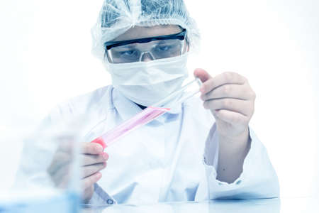  laboratory assistant analyzing a liquidの写真素材