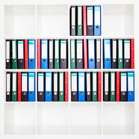 File folders, standing on the shelves at office.の写真素材