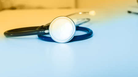 Blue stethoscope on white.の写真素材