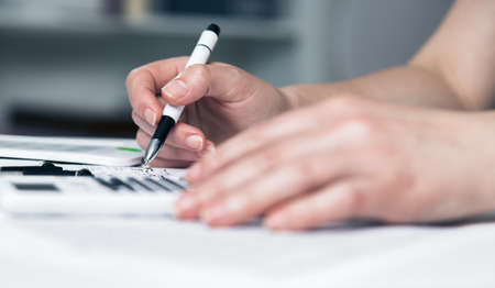 woman write on paper. organizer and pen. business background