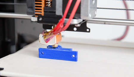 Electronic three dimensional plastic printer during work , 3D printer, 3D printingの写真素材