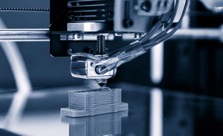 Electronic three dimensional plastic printer during work , 3D printer, 3D printingの写真素材