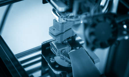 Electronic three dimensional plastic printer during work , 3D printer, 3D printingの写真素材