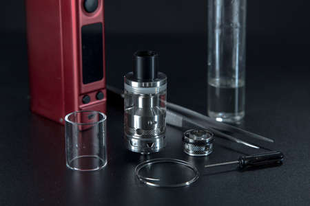 vape e liquid for electronic cigarette on a dark background
