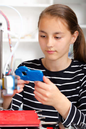 Schoolgirl with 3d printed. education, technology.の写真素材